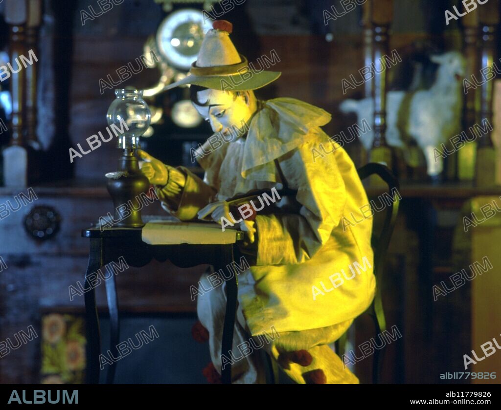 Automata - Toy Museum . York. Pierrot writing to Columbine. Pierrot eventually falls asleep and the lamp dies out. Wakes, relights lamp and contiinues writing.