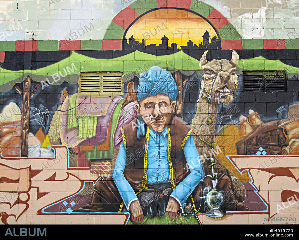 Pintura de un vendedor árabe con turbante en su tienda, graffiti mural, Mataró, provincia Barcelona, Barcelona en 2013.