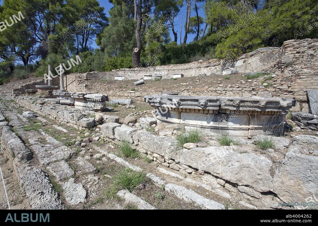A nymphaeum in Olympia, Greece. A nymphaeum was a monument consecrated to the nymphs, especially those of springs. This particular nymphaeum was built by Herodes Atticus about AD 160 in memory of his wife Regilla, a priestess of Demeter, and in honor of the Imperial house. Olympia, a sanctuary of ancient Greece, is probably best known for having been the site of the Olympic Games in classical times.
