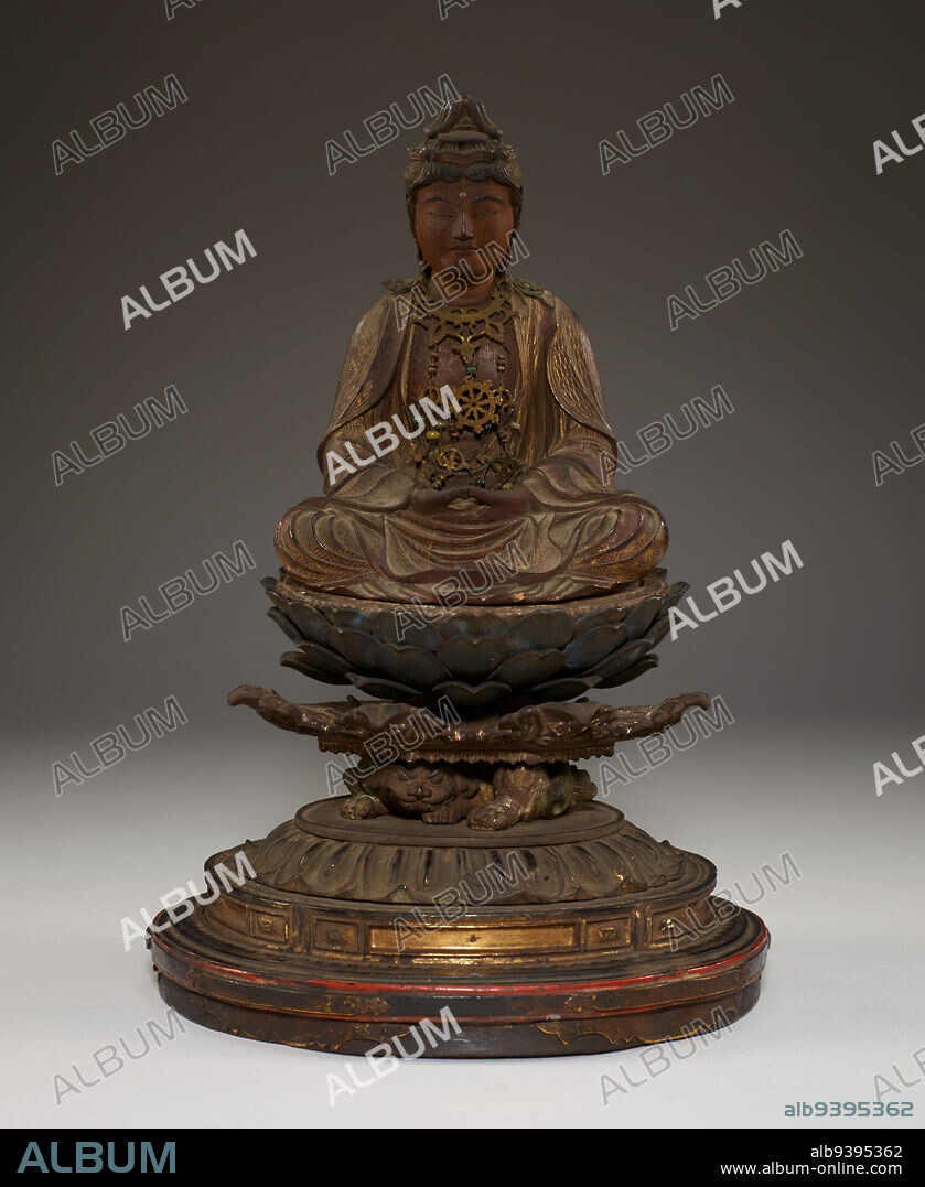 Miroku, the Bodhisattva of the Future, second half 13th century, Unknown Japanese, 11 1/2 × 7 1/2 × 6 5/8 in. (29.21 × 19.05 × 16.83 cm), Wood with metal, cut gold leaf (kirikane), polychrome, and inlaid crystal eyes, Japan, 13th century, Miroku Bosatsu is seated on a lotus throne perched on a struggling demon, holding a pagoda in his upturned palms. The statue retains its original metal raiments, as well as the gold leaf decoration on the draped robes. The figures princely attire indicates that Miroku is being depicted in his incarnation as a bodhisattva, an enlightened being who delays nirvana in order to guide others to enlightenment, rather than his incarnation as the future Buddha.