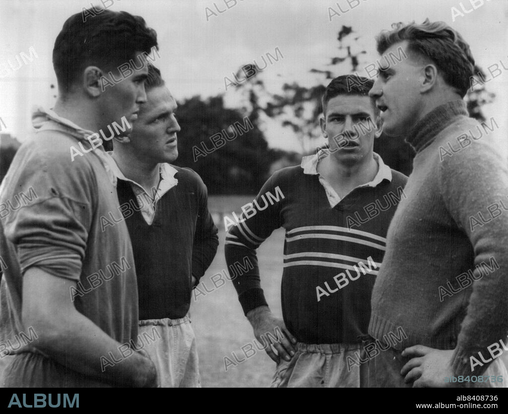 Coach "Jika" Travers (right) gets a good hearing as he talks tactics to forwards Rex Mosson, Doug Stewart and Ian McKellar, who will play for North Harbor against South in Saturday's Rugby Union match at North Sydney Oval. May 1, 1951.