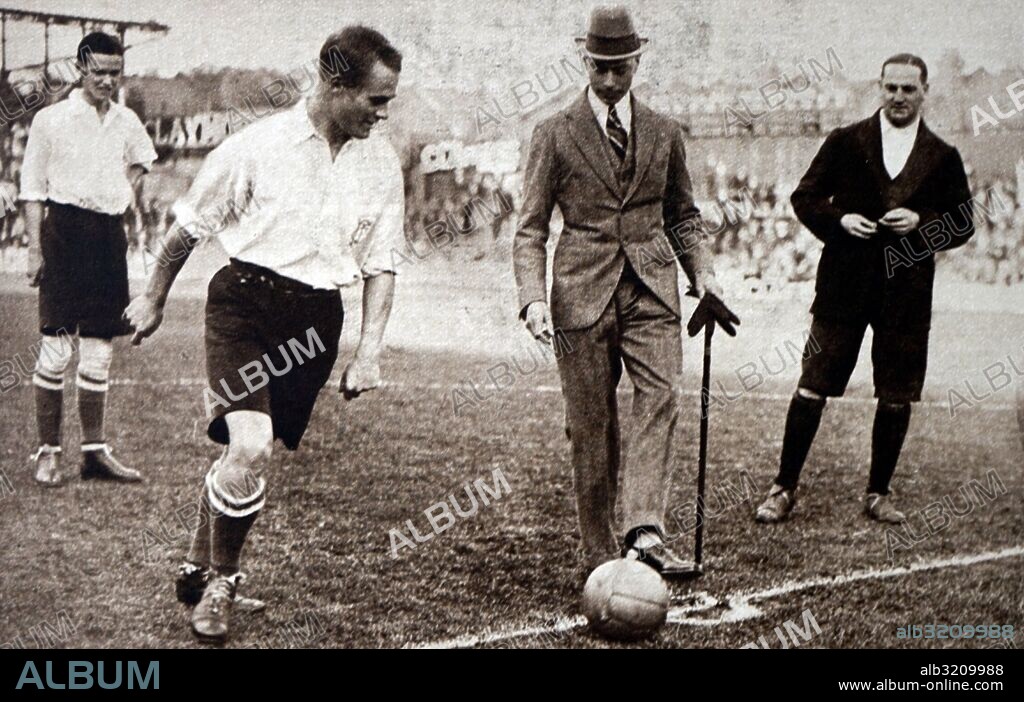 Photograph of Prince Albert Frederick Arthur George (1895-1952) kicking off a football match. Dated 20th Century.
