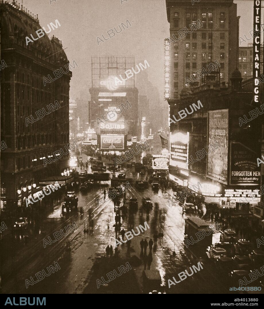 Winter evening on Times Square and Broadway, New York, USA, early 1930s. View showing cinemas and theatres.