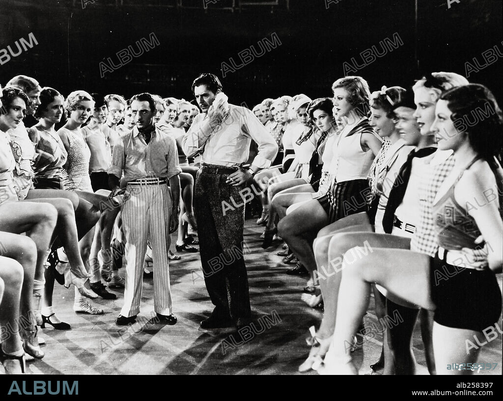 GEORGE E. STONE, GINGER ROGERS and WARNER BAXTER in 42ND STREET, 1933, directed by LLOYD BACON. Copyright WARNER BROTHERS.