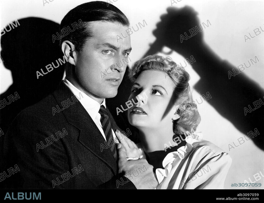 MARJORIE REYNOLDS and RAY MILLAND in MINISTRY OF FEAR, 1944, directed by FRITZ LANG. Copyright PARAMOUNT PICTURES.