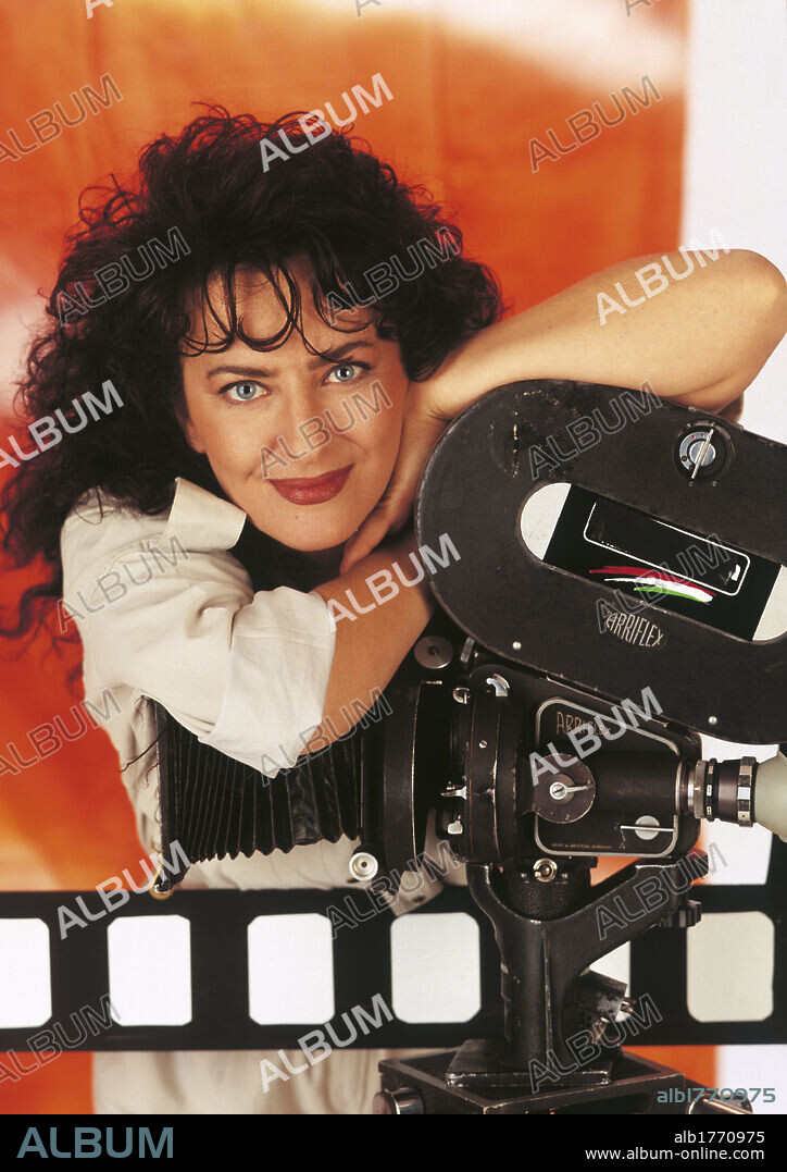 Portrait of Francesca Draghetti. Italian comedy actress and member of Premiata Ditta Francesca Draghetti leaning on a tv camera. 1995.
