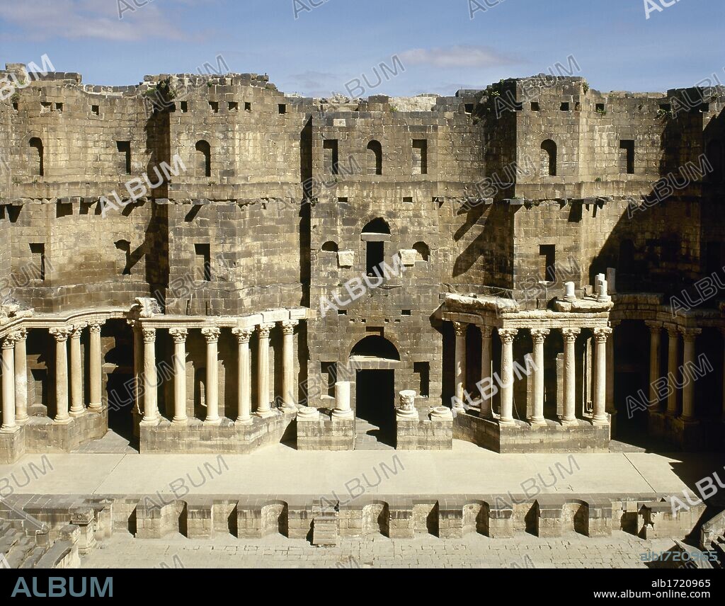 Syria. Bosra. Roman Theatre. Constructed using black basalt. 2nd century AD, during the reign of Trajan. View of the stage (Scaenae frons, porticus post scaenam, pulpitum). Photo taken before the Syrian Civil War.