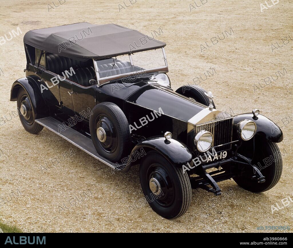 A 1925 Rolls-Royce Phantom I. The Phantom I was a successor to the Silver Ghost. This example was bought in 1925 by Lord Montagu's father and was used by him until his death in 1929. It was delivered new with bodywork by Hooper & Co. (Coachbuilders) Ltd. During the Second World War it was fitted with a mobile canteen body and saw service with the NAAFI (Navy, Army and Air Force Institutes). Later, it was used to tow gang mowers around playing fields in Somerset, before being stored in a dilapidated state on a farmyard. The car was bought by the present Lord Montagu, and reconstructed for the Museum by Leslie Willis.