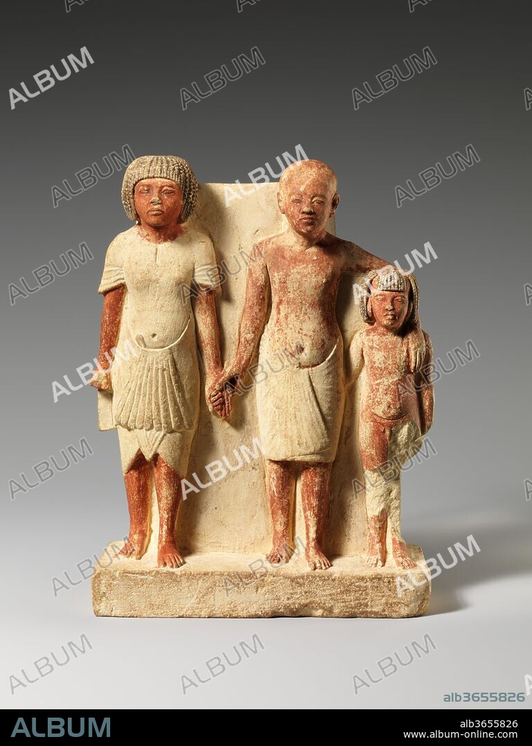 Statue of two men and a boy that served as a domestic icon. Dimensions: h. 17 cm (6 11/16 in); w. 12.5 cm (4 15/16 in); 
D of base next to man 5.7 cm (2 1/4 in); D next to boy 4.8 cm (1 7/8 in). Dynasty: Dynasty 18. Reign: reign of Akhenaten. Date: ca. 1353-1336 B.C..
All of the individuals in this small group are males, represented according to the conventions of Amarna art. The intriguing group has been variously interpreted as a family comprising a grandfather, a father, and a son, or as one man at three different stages of life. The latter is most unlikely as the multiple representations of a single individual in one statue are not shown interacting as they do here. In fact careful examination of the faces and figures points to the statue's being a kind of domestic icon. The figure at left is a high-status individual and likely the oldest; he is probably a revered relative or the respected overlord of the man and boy who stand closely entwined with one another. The statuette would probably have received veneration in the household of its owner.