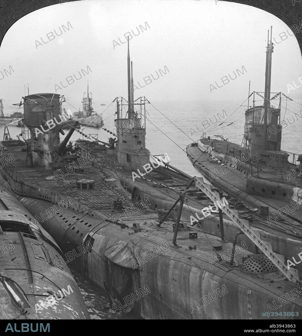 German submarines secured in a Channel port, c1918-c1919. After the German surrender, the Allies stipulated that all seaworthy U-boats be handed over to them, and all those in shipyards be broken up. From a box set of stereoscopic cards titled 'The Great War'.