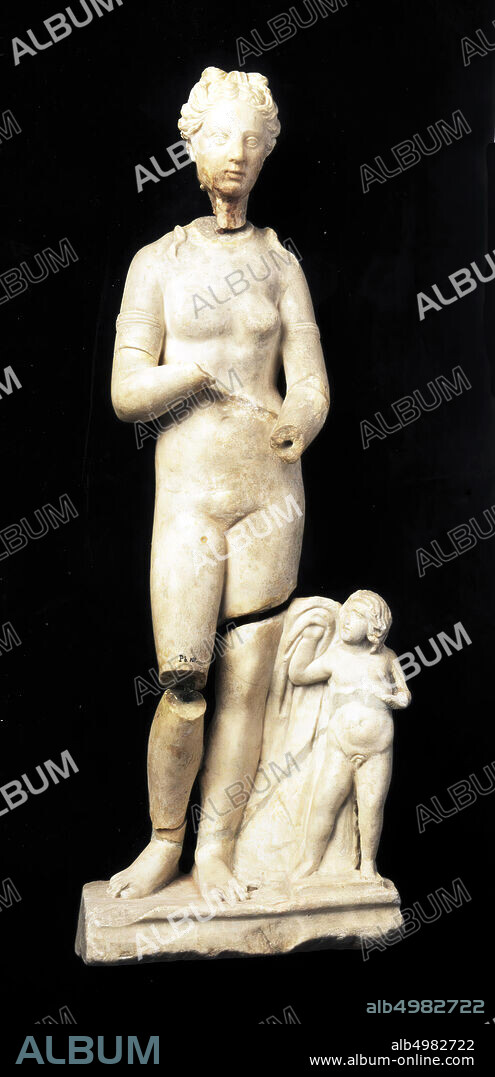 Statue of naked female figure, type Venus Capitolina. Wrists, hands and knee (?) Are missing. The object now consists of four separate parts., Part 1) head with inventory number, part 2) torso with arms and upper legs also numbered, part 3) the basis with the child and part of left leg and right foot. Is numbered., Part 4) Right lower leg not numbered., Some loose fragments from fracture line abdomen and connectionpin for between both calves is also loose., Several separate parts were at the object, but do not belong: among others a knee with a part of the upper leg and some loose fragments., sculpture, statue, stone, marble, 37 cm, imperial time 50.