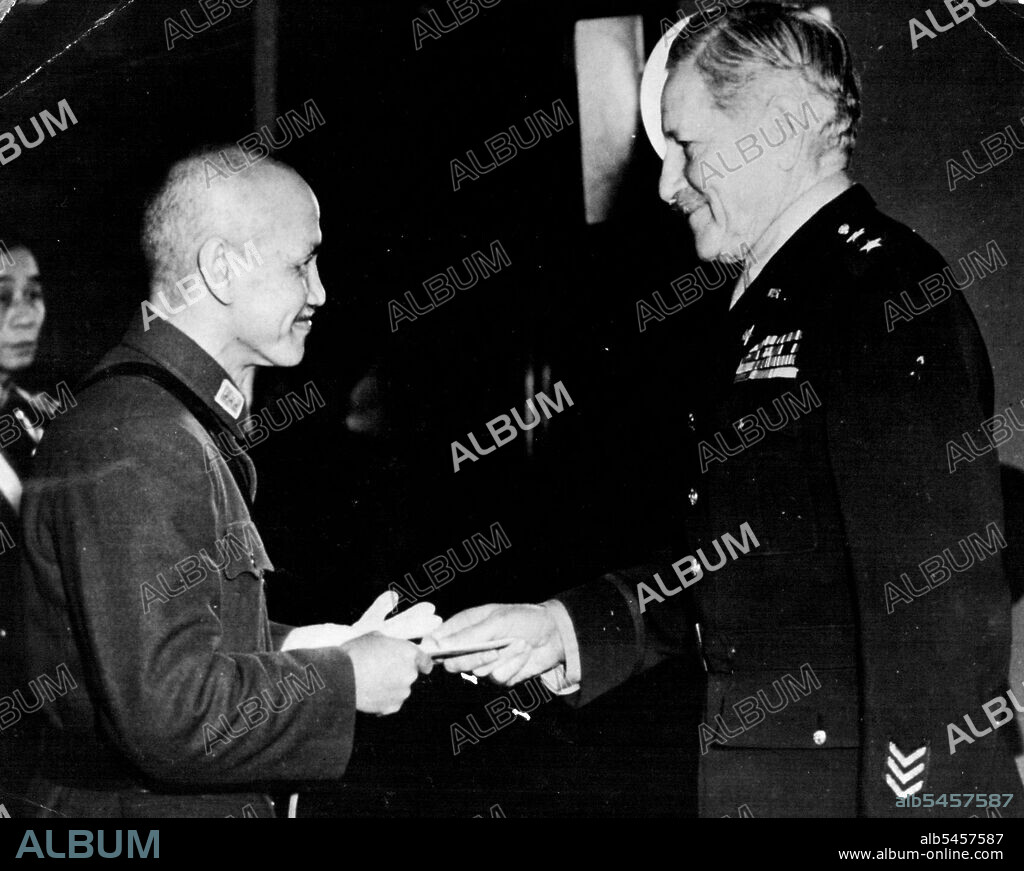 Generalissimo Greets American Ambassador -- American Ambassador to China Maj. Gen. Patrick J. Hurley (right) shakes hands with Generalissimo Chiang Kai-Shek after presenting his credentials at the Government House in Chungking. January 24, 1945. (Photo by Official Chinese Photo).