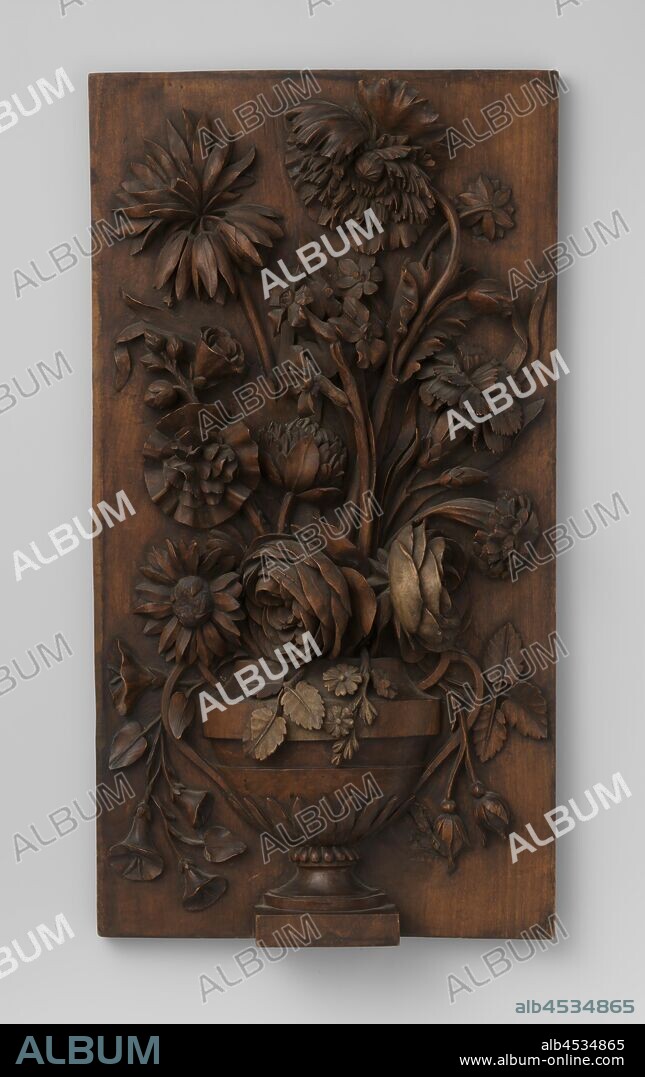 Furniture fragment with flower vase carved in high relief, Panel of walnut carved in high relief, flower vase, urn shape with two ears, with flowers., c. 1450 - c. 1950, walnut (hardwood), h 50 cm × w 26.5 cm × d 5 cm.