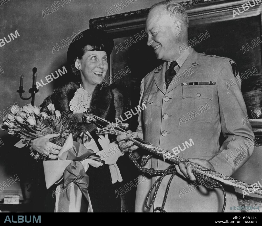 General Eisenhower Named North Atlantic Defense Force Commander -- General of the Army Dwight D. Eisenhower and Mrs. Eisenhower with the Sword of Honor presented to the General as a gift from Queen Wilhelmina of the Netherlands in appreciation for his able leadership of the Allied Forces in liberating the people of Holland in 1945. This is only one of approximately forty decorations from foreign countries which have been presented to the General. The list of governments which have so honored him reads like the roster of the United Nations and includes Czechoslovakia, Poland and Russia. May 24, 1951. (Photo by United States Information Service).