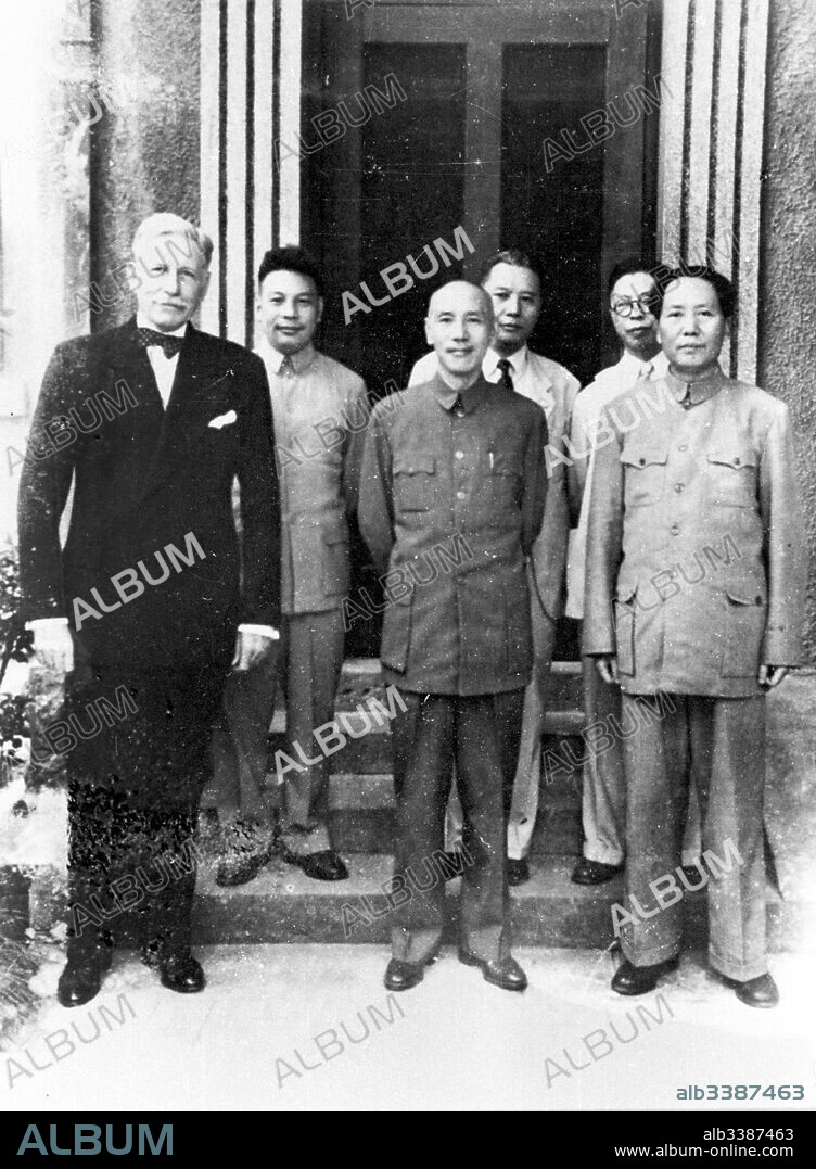 President of Nationalist China, Chiang Kai-shek with Chinese Communist leader Mao Zedong, meeting in Chongqing, China, 1945. The US Ambassador, Patrick Hurley stands with them.
