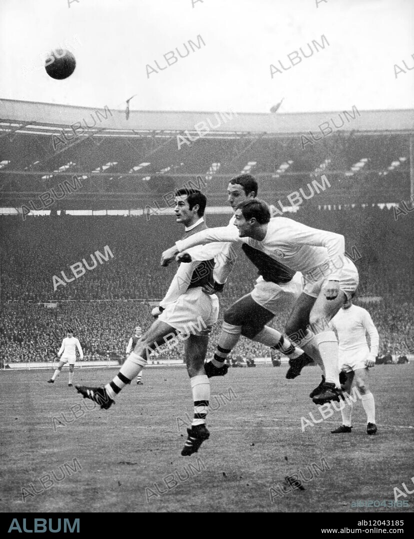 2nd March 1968: The football league cup final at Wembley. Arsenal versus Leeds United. Photo shows: Arsenal's centre-forward, George Graham, outside-right, John Radford and Leeds centre-forward, Paul Madeley (left to right) in action in the Leeds goalmouth.