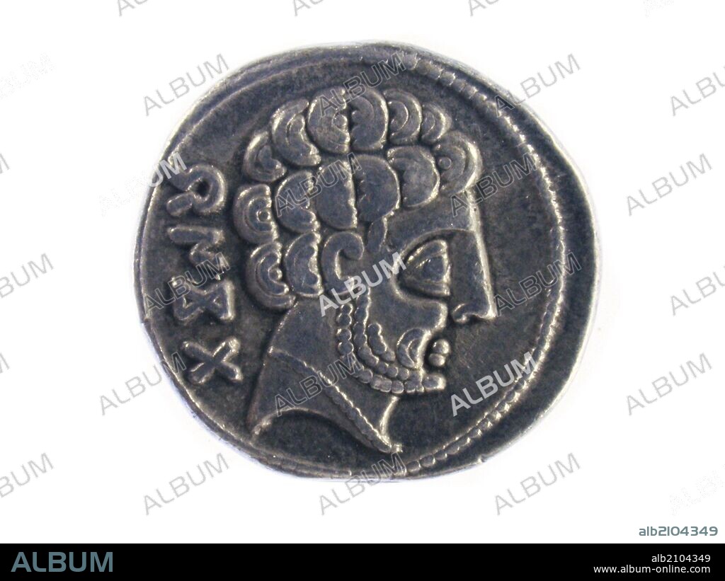 NUMISMATICA. MONEDA BERICA. DENARIO IBERICO DE BASCUNES. ANVERSO. PERFIL DE HOMBRE CON MELENA RIZADA Y BARBA. INSCRIPCION AL LADO IZQUIERDO DEL PERFIL. (DEPOSITO: MUSEO ARQUEOLOGICO NACIONAL).