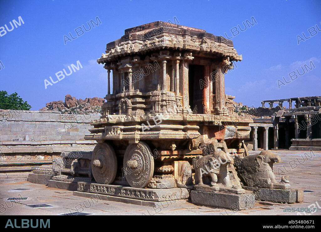 The Vittala Temple, built in the early 16th century, is devoted to the Hindu god Vithoba (also known as Vitthala and Panduranga), an incarnation of Vishnu or his avatar Krishna. Hampi is a village in northern Karnataka state. It is located within the ruins of Vijayanagara, the former capital of the Vijayanagara Empire. Predating the city of Vijayanagara, it continues to be an important religious centre, housing the Virupaksha Temple, as well as several other monuments belonging to the old city.