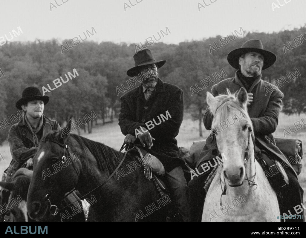 CLINT EASTWOOD and MORGAN FREEMAN in UNFORGIVEN, 1992, directed by CLINT EASTWOOD. Copyright WARNER BROTHERS.