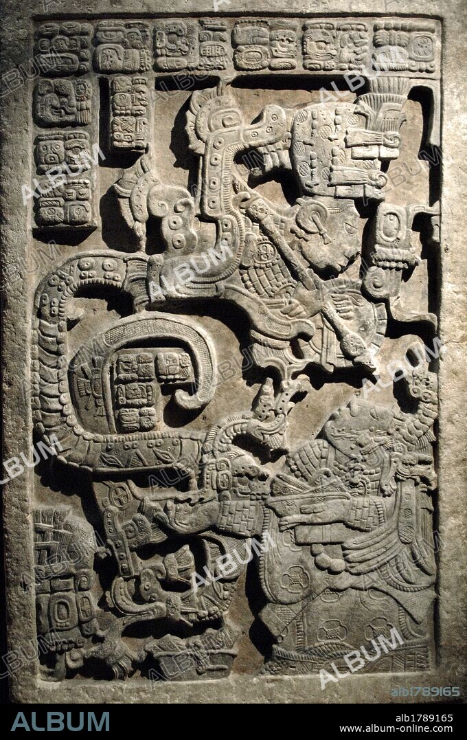 Lintel 25. Lady K'ab'al Xook. Lady Xook is in the hallucinatory stage of the bloodletting ritual. She conjures before her a vision of a Teotihuacan serpent. This lintel is one of a series of three panels from Structure 23 at Yaxchilan. Limestone, 725-760. Late Classic Maya. Yaxchilan, Chiapas state, Mexico. British Museum. London, England, United Kingdom.