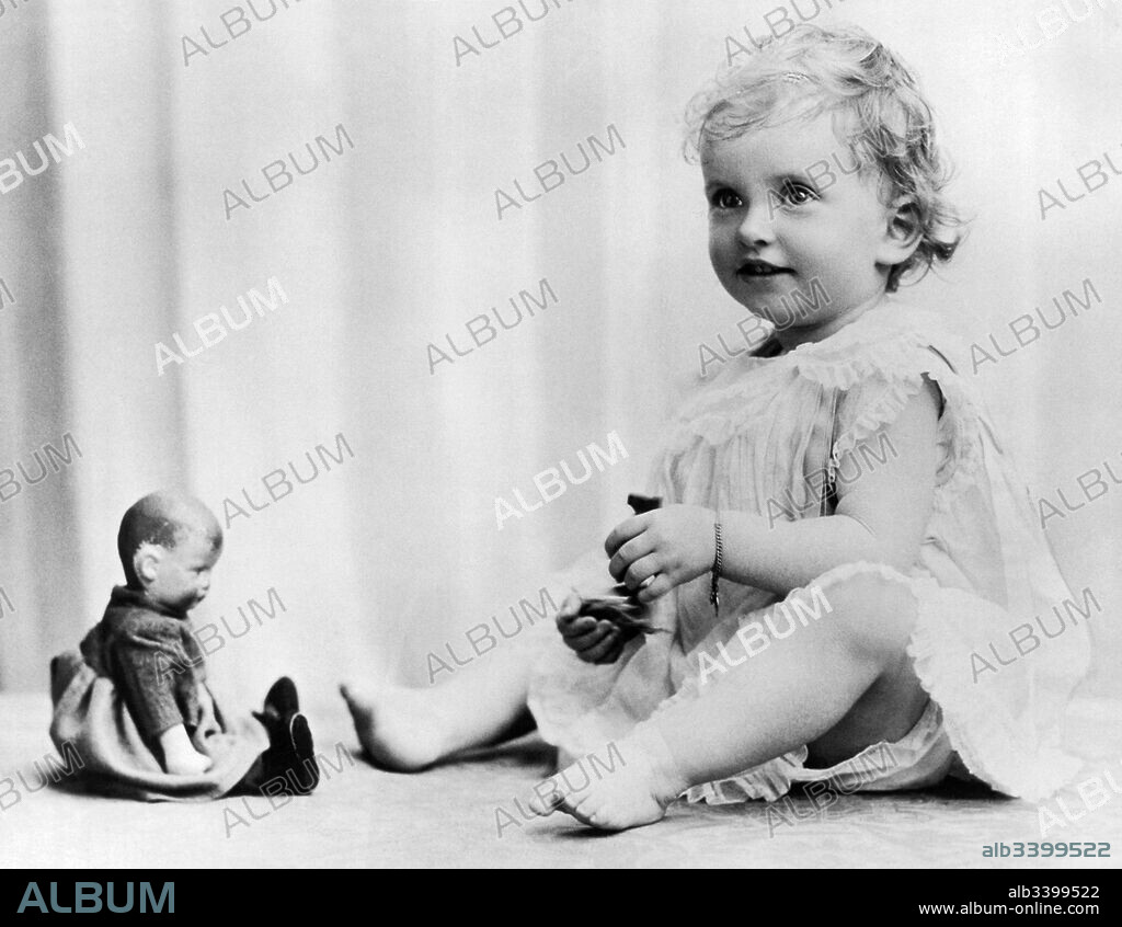 England:  July 14, 1925 A portrait of Patricia Mountbatten playing with her dolls. She is the daughter of Lord and Lady Louis Mountbatten, and the great grand daughter of King Edward VII.