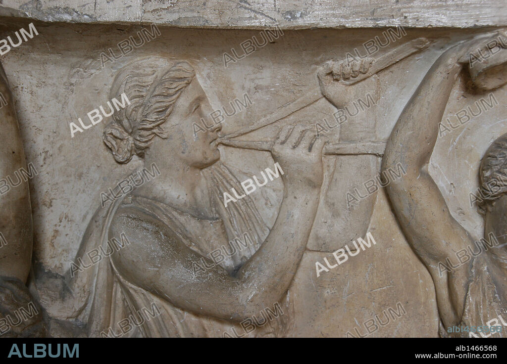 Roman Art. Woman playing double flute "Aulos". Relief. Detail of sarcophagus. Vatican Museums. City of the Vatican.
