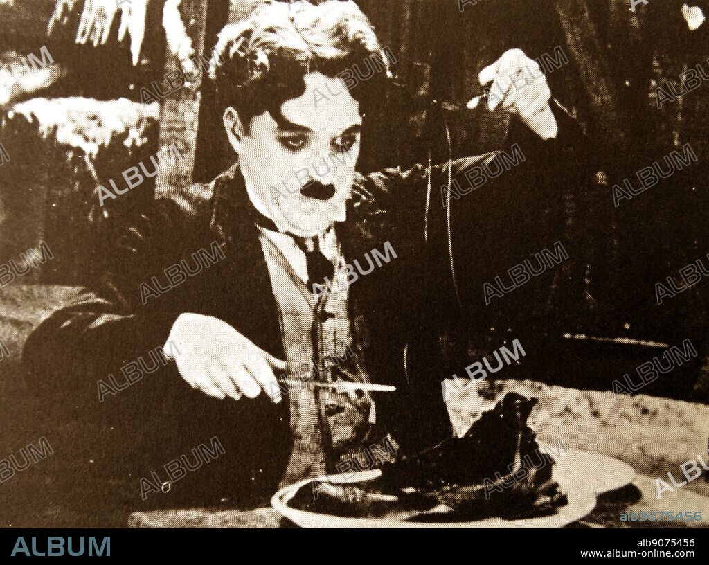 The Gold Rush'. Treating the laces as spaghetti and the sole as meat, the starving prospector eats his shoe. 1925 silent comedy film starring Charlie Chaplin.