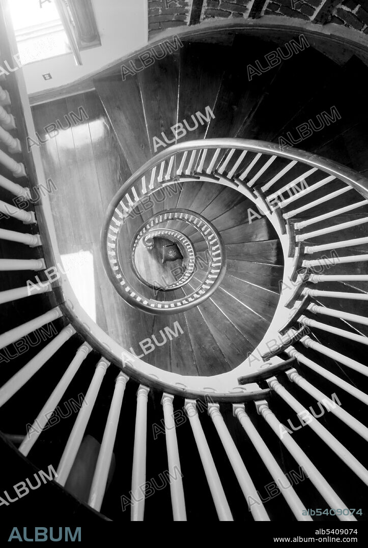 Spiral staircase. Christopher Belser House, Charleston, SC. Spiral stairs wind around a newel (central pole). They typically have a handrail on the outer side only, on the inner side just the central pole, and are often very steep. A pure spiral assumes a circular stairwell and the steps and handrail are equal and positioned screw-symmetrically. A tight spiral stair with a central pole is very space efficient in the use of floor area. A squared spiral stair assumes a square stairwell and expands the steps and railing to a square, resulting in unequal steps. Historic American Buildings Survey, undated (cropped and cleaned).