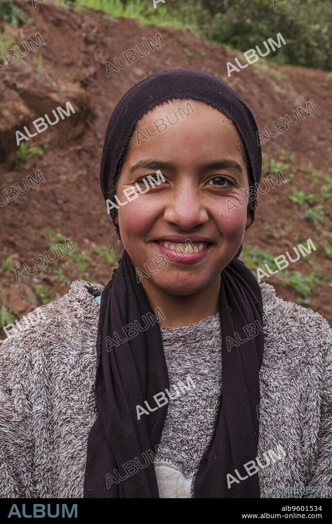 teenage berber girl with headscarf, Ait Blal, azilal province, Atlas mountain range, morocco, africa.