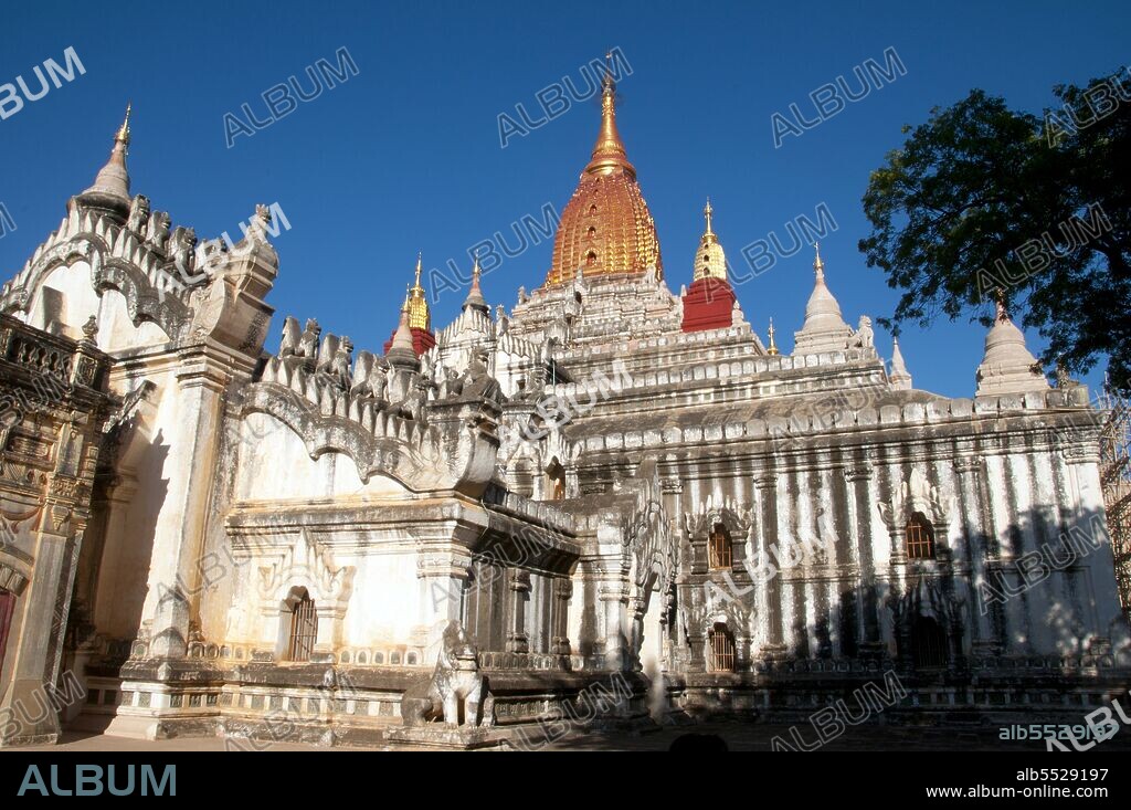 Perhaps the highest revered temple in Bagan, the Ananda Pagoda was built in 1105 CE during the reign of King Kyanzittha (1084–1113) of the Bagan Dynasty. It is one of four surviving original temples of Bagan (also called Pagan). The temple layout is in a cruciform with several terraces leading to a small pagoda at the top covered by an umbrella (‘hti’). The Buddhist temple houses four standing Buddhas—facing east, north, west and south. The temple is said to be an architectural wonder in a fusion of Mon and adopted Indian styles of architecture. It was damaged in the earthquake of 1975. However, it has been fully restored and is well maintained by frequent painting and whitewashing of the walls. On the occasion of the 900th anniversary of its construction celebrated in 1990 the temple spires were gilded. Bagan, formerly Pagan, was mainly built between the 11th century and 13th century. Formally titled Arimaddanapura or Arimaddana (the City of the Enemy Crusher) and also known as Tambadipa (the Land of Copper) or Tassadessa (the Parched Land), it was the capital of several ancient kingdoms in Burma.