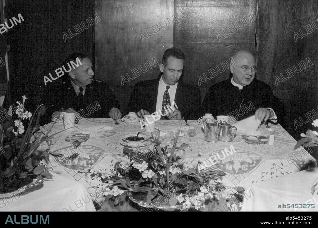 Lt. Gen. William K. Harrison, Deputy Commander Affe, James Duffy, President of the Yokohama chapter council of Catholic men in Japan and Francis Cardinal Spellman at the breakfast in the Cardinal's honor at the Yokohama Chapel center in Japan after he said mass there on new year's day. January 01, 1953. (Photo by Frank Agolia, U.S. Army).