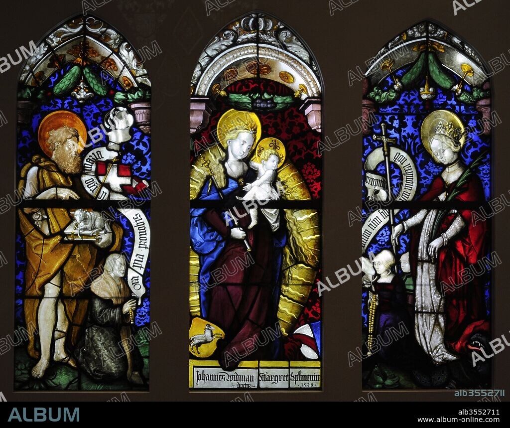 Virgin in an Aureola with St. John the Baptist and St. Margarete from the Charterhouse in Freiburg, Germany. Workshop of Hans Gitschmann, called von Ropstein, 1528. Stained glass. Schnu_tgen Museum. Cologne, Germany.