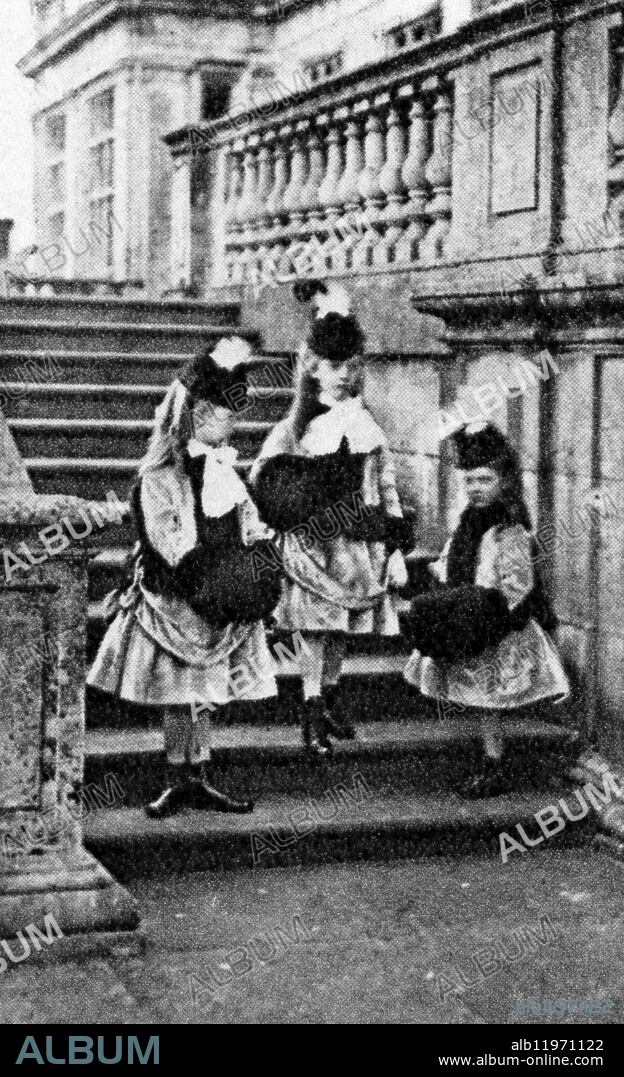 Lady Katherine, Lady Alice and Lady Beatrice Thynne in fashionable dress on the front steps of Longleat in 1871. ©TopFoto.
