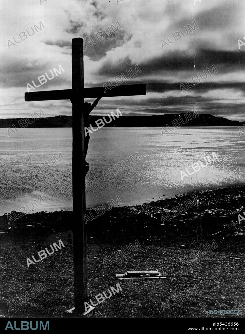 This Calvary erected on the lonely foreshore at Port Jeanne D'Arc Kerguelen by the members of a French scientific Mission bears the inscription. "In recognition of the benefits that Divine Providence has accorded us during our voyage and our stay at Kerguelen, we have erected this Calvary which we place under the safeguard, and recommend to pious cases of all these who come here after us." April 15, 1930. (Photo by Captain Frank Hurley, The Herald Feature Service).