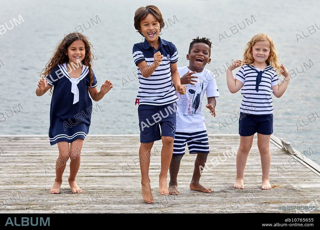 Children with sea clothes, Marina Urola, Santiago beach, Zumaia, Gipuzkoa, Basque Country, Spain, Europe.