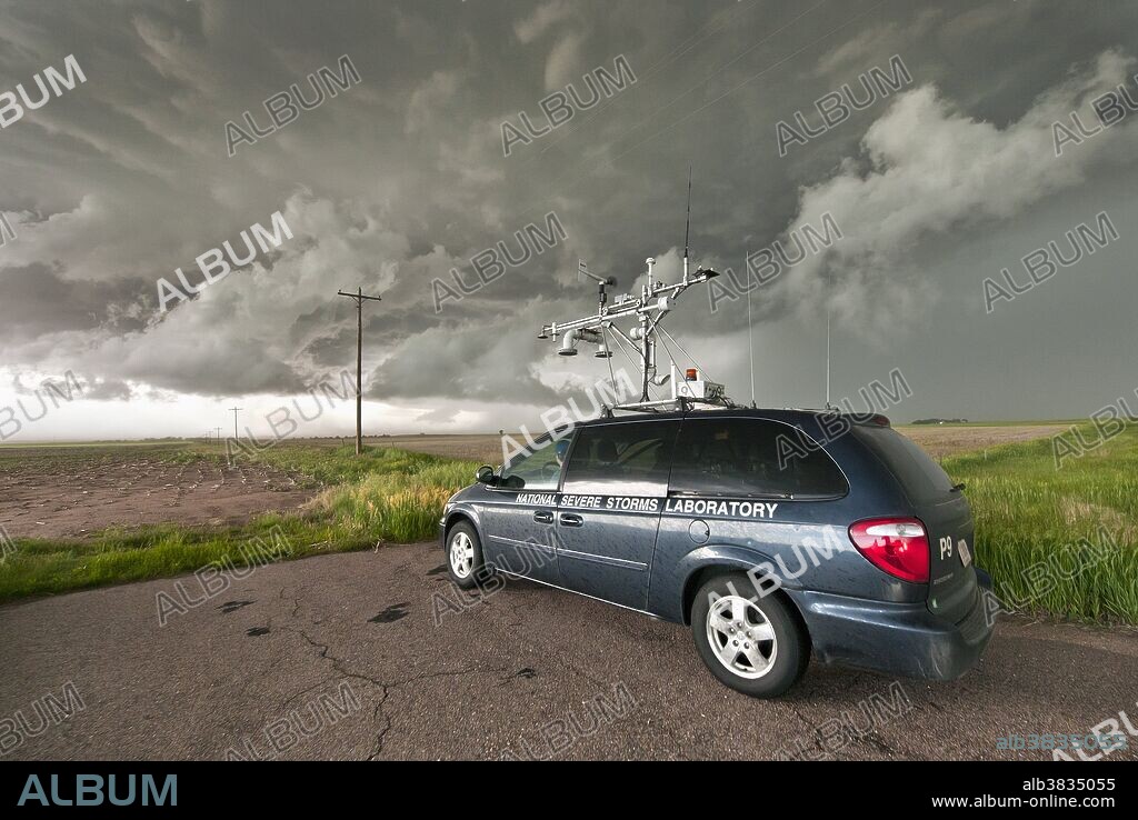 Researchers with VORTEX 2 use a tornado probe vehicle, with roof-mounted mobile mesonet unit, to study an approaching severe thunderstorm in Nebraska on June 6, 2010. The tornado probe is one of several research vehicles that participated in VORTEX 2, an unprecedented two-year science project to study tornadoes in the United States in 2009 and 2010.