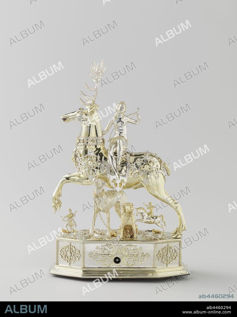 Table automaton in the form of Diana on a stag, Table automaton in the form of Diana on a deer, Diana, seated on a deer. Automatic silver, partly gold-plated. The deer, which has a removable head and wears a crown, is surrounded by openwork band ornament. Similar decorations around the eight-sided pedestal, on which all kinds of insects and animals are placed on a natural base, including two hunting dogs, a horseman and a hunter. A few holes point to other lost additions. Diana looks back. She wears a bow and an arrow quiver on the back and holds in her raised left hand the end of the chain that once connected the dogs, (story of) Diana (Artemis), Diana hunting, Jacob Miller (edelsmid), Augsburg, c. 1613 - c. 1615, silver (metal), iron (metal), gilding, h 62.3 cm × w 25.0 cm × d 12.8 cm.