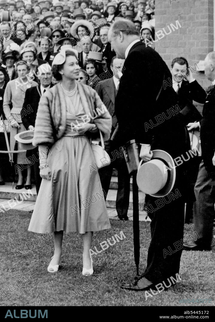 The Queen's Lucky Day at Ascot. Her Majesty The Queen smilingly congratulates her trainer C. Boyd-Rochfort in the winners enclosure after Aureole ridden by E. Smith had won the Hardwicks Stakes at Ascot today. It was The Queen's lucky day at Ascot today, the fourth day of the Meeting. The Royal luck began when Her Majesty's colt Landau won The Rous Memorial Stakes, the first race of the day; in the following race, The Windsor Castle Stakes, The Queen's horse Corporal was second and then to complete a happy day for Her Majesty Aureole won The Hardwicke Stakes. June 18, 1954. (Photo by Fox Photos).