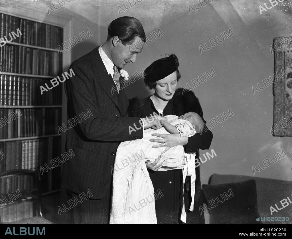 Mr and Mrs Duncan Sandys with their infant son Julian George Winston , whose christening took place in the crypt of the House of Commons . Mrs Sandys is the daughter of Mr Winston Churchill . 2 November 1936.
