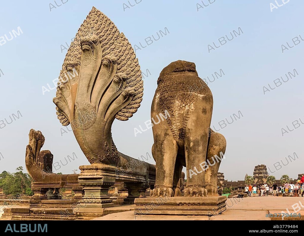 Seven-headed Naga and decapitated lion figure on the western access route, Angkor Wat temple, Siem Reap Province, Cambodia, Asia.