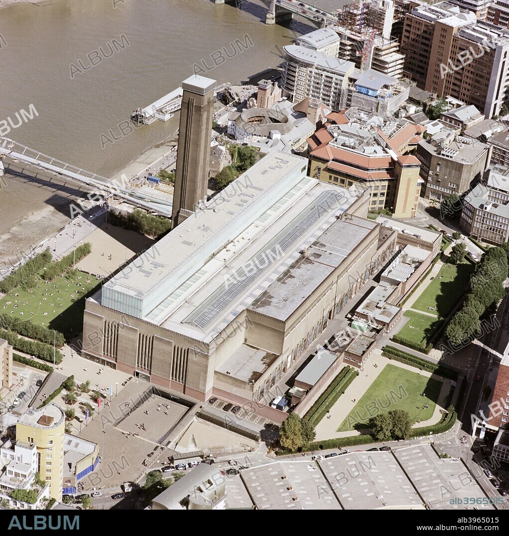Tate Modern (Bankside Power Station), London, 1901. Like Battersea this power station (now the Tate Modern) was designed by Sir Giles Scott and was opened in 1963. Its characteristic single chimney stands at the southern end of the controversial Millennium Bridge. To the right of the chimney is the reconstruction of Shakespeare's Globe Theatre.