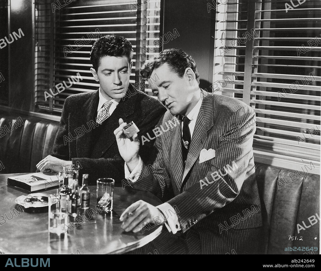 FARLEY GRANGER and ROBERT WALKER in STRANGERS ON A TRAIN, 1951, directed by ALFRED HITCHCOCK. Copyright WARNER BROTHERS.
