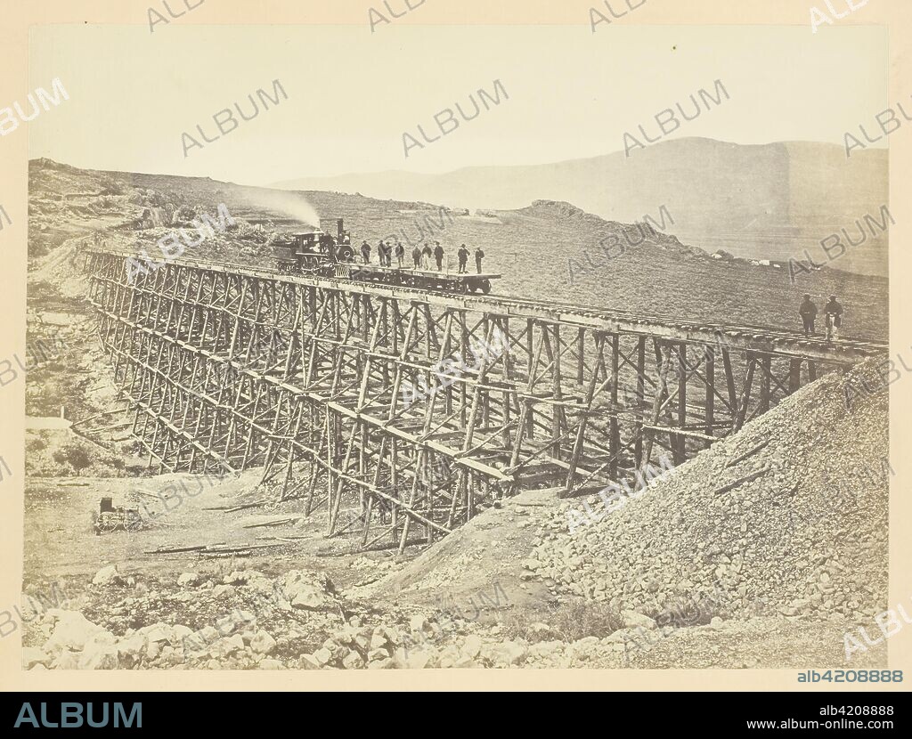 ANDREW JOSEPH RUSSELL. Trestle Work, Promontroy Point, Salt Lake Valley. Andrew J. Russell; American, 1830-1902. Date: 1868-1869. Dimensions: 15.3 x 20.4 cm (image/paper); 23.3 x 30.3 cm (album page). Albumen print, pl. XXVIII from the album "Sun Pictures of Rocky Mountain Scenery" (1870). Origin: United States.