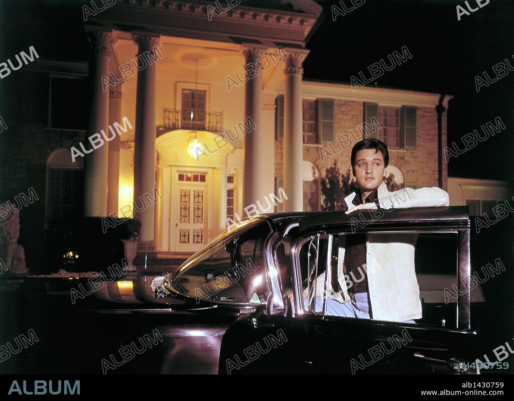 Mar. 7, 1965 - Memphis, TN, U.S. - Elvis Presley posed with one of his cars outside Graceland in this photograph published March 7, 1965 in the first issue of Mid-South, the now-defunct Sunday magazine of The Commercial Appeal. Elvis complained of the long sessions with photographers making movie publicity stills: ''I try to cut the time down to three or four hours, but sometimes you have to pose for six or eight. A man only has so many different smiles, and I don't have many. 07/03/1965