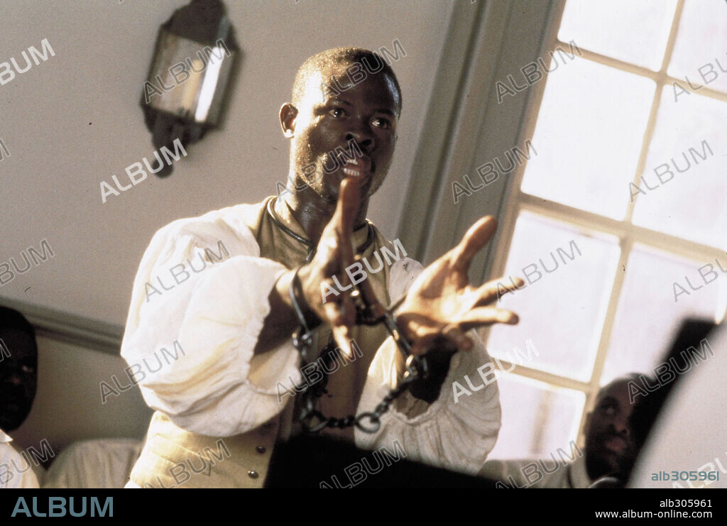 DJIMON HOUNSOU in AMISTAD, 1997, directed by STEVEN SPIELBERG. Copyright TM & DREAMWORKS / COOPER, ANDREW.