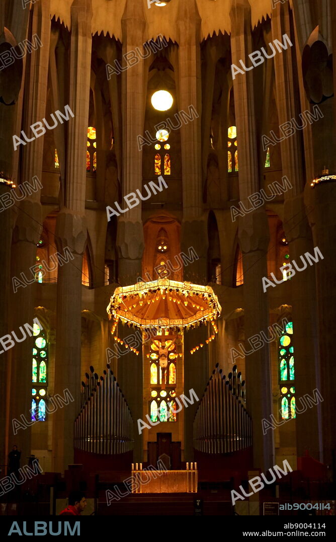 View of the suspended crucifix and glass altar within the Basílica i Temple Expiatori de la Sagrada Família, a Roman Catholic church in Barcelona, designed by Spanish architect Antoni Gaudí (18521926). Dated 21st Century.