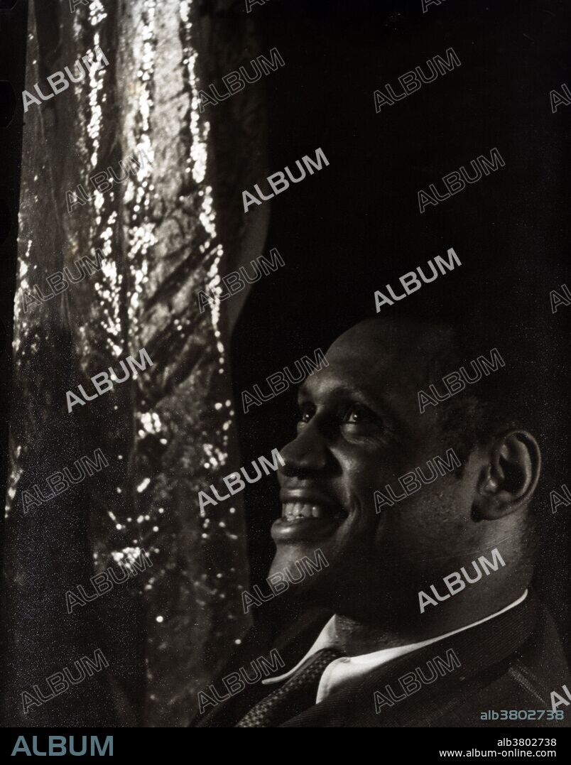 Paul Leroy Robeson (April 9, 1898 - January 23, 1976) was an American singer and actor. He won an academic scholarship to Rutgers College, where he became a football All-American and the class valedictorian. He received his LL.B. from Columbia Law School, while playing in the National Football League (NFL). At Columbia, he sang and acted in off-campus productions; and, after graduating, became a participant in the Harlem Renaissance. in the 1930s he became an international film star through roles in Show Boat and Sanders of the River. He became politically involved in response to the Spanish Civil War, fascism, and social injustices. During WWII, he supported America's war efforts and won accolades for his portrayal of Othello on Broadway. His advocacy of anti-imperialism, affiliation with communism, and criticism of the U.S. government caused him to be blacklisted during the McCarthy era. He was denied a passport by the U.S. State Department, and his income, consequently, plummeted. He moved to Harlem and published a periodical critical of United States policies. His right to travel was eventually restored in 1958. He retired in 1963 and died in 1976, following complications of a stroke, at the age of 77. Photographed by Carl Van Vechten June 1, 1933.
