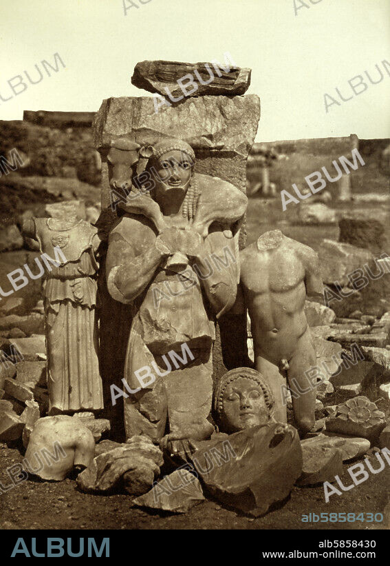 UNKNOWN PHOTOGRAPHER. The Moschophoros (Calf-bearer) and the torso of the Kritios Boy shortly after exhumation on the Acropolis in Athens (Greece). Ca. 1865.