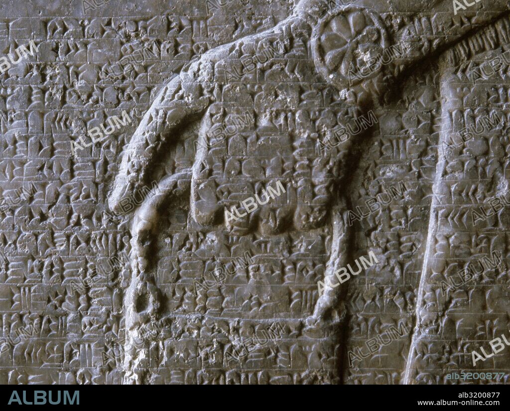 Mesopotamia, Assyrian. Neo-Assyrian period. Reign of Ashurnasirpal II. 883-859. Palace of Nimrud, Iraq. Winged Genius and cuneiform script. Relief. Detaiol of the hand. Louvre Museum. Paris, France.