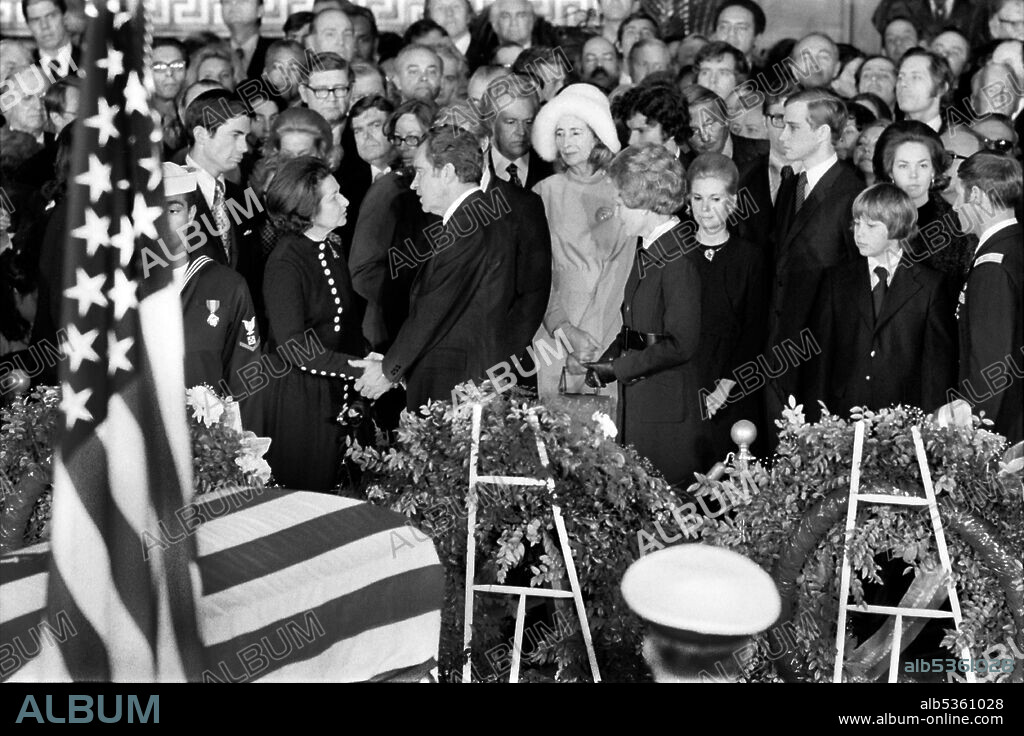 U.S. President speaking with Claudia "Lady Bird" Johnson during former U.S. President Lyndon Johnson's Funeral inside Capitol Building, Washington, D.C., USA, Marion S. Trikosko, January 24, 1973.